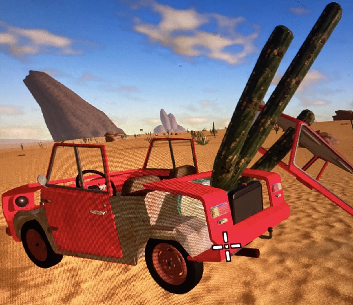 A red desert buggy with cacti sticking out of it